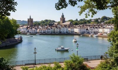 Scenic view of Pabington town featuring historic buildings, lush landscapes, and vibrant Market Square filled with local artisans